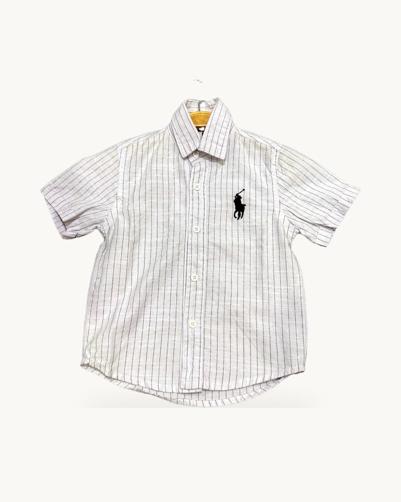 White and pink striped shirt on a hanger