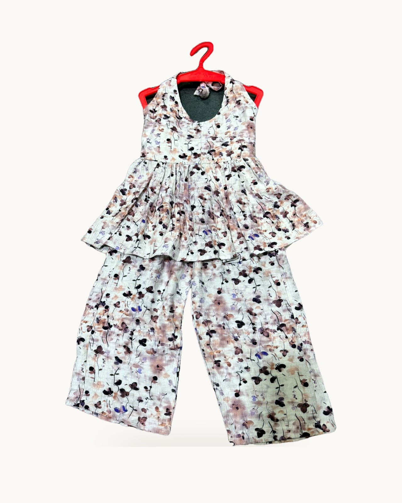 Girls floral halter top and wide-leg pants set on a hanger